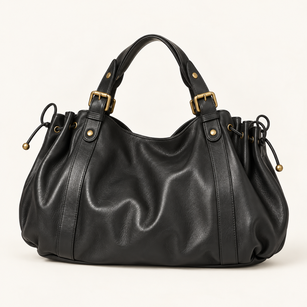 Valen Hobo in Classic Black, front view with gathered silhouette, adjustable shoulder strap and brass-tone hardware.