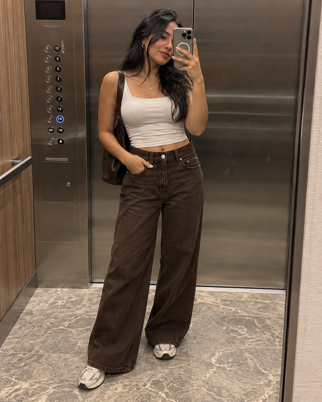 The Valen Wide-Leg Jean in Chocolate Brown styled with a cream sleeveless top