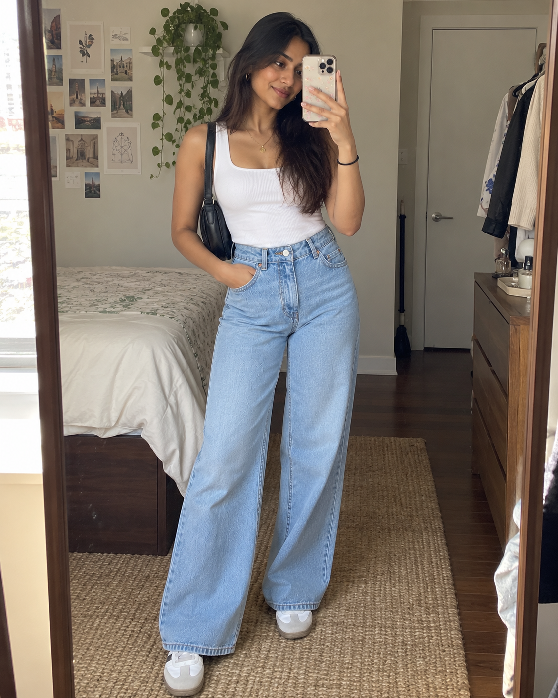 The Valen Wide-Leg Jean in Light Wash Blue styled with a white top indoors